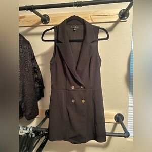 Never worn, black, double breasted, blazer romper. From Francesca’s size medium.